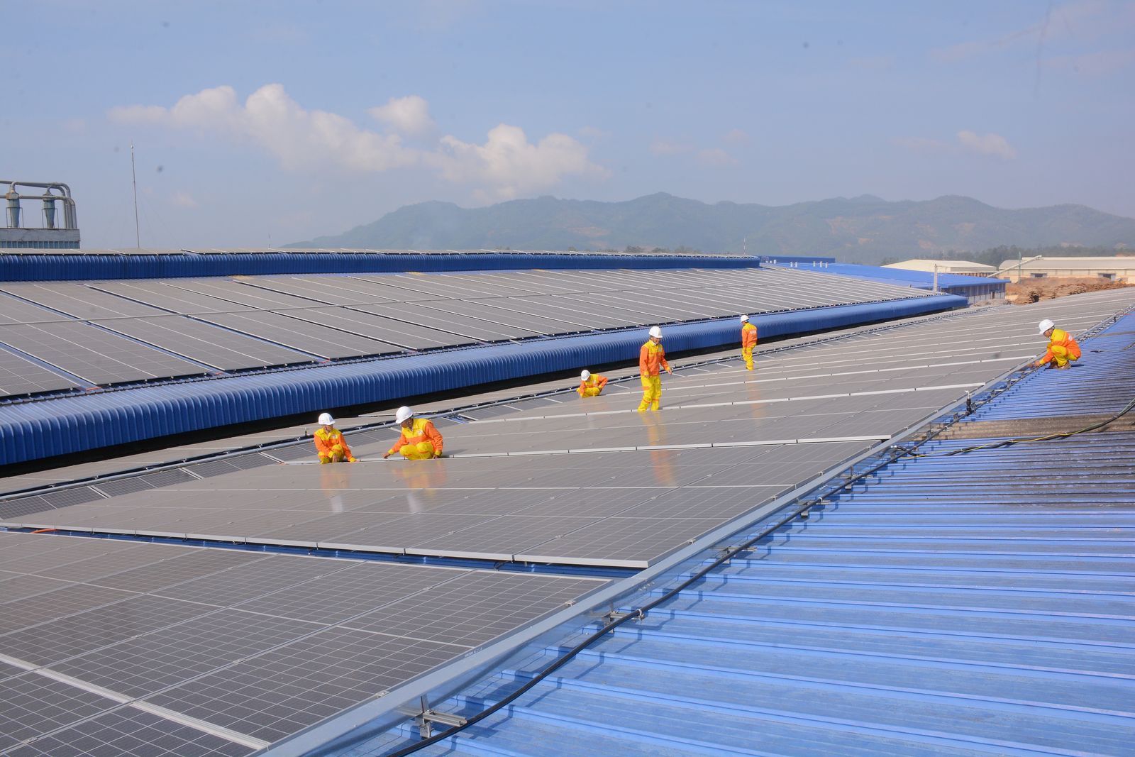 A commissioning technician walking a completed array