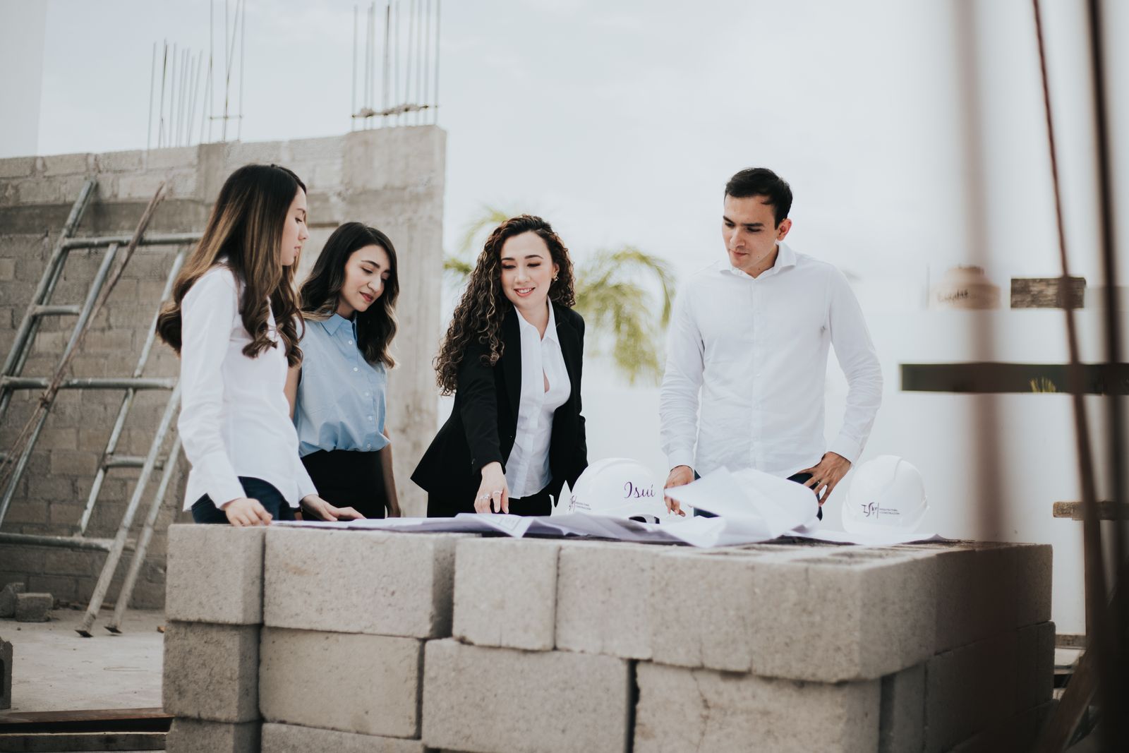 Engineers reviewing drawings on a construction site